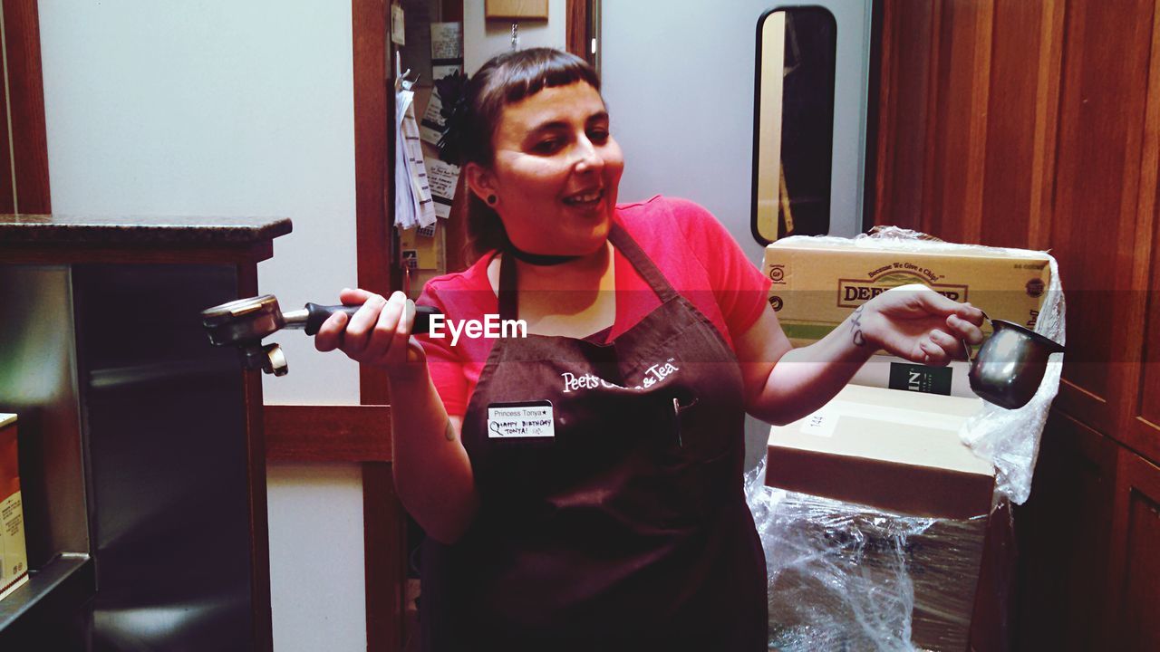 Portrait of a happy barista