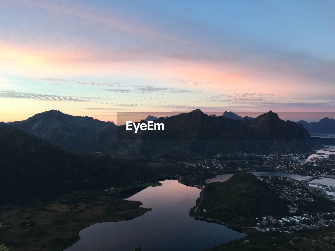 Scenic view of mountains against sky at sunset