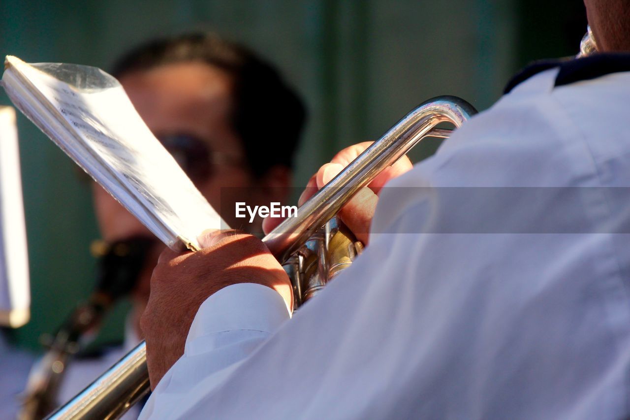 Close-up of man playingt trombone 