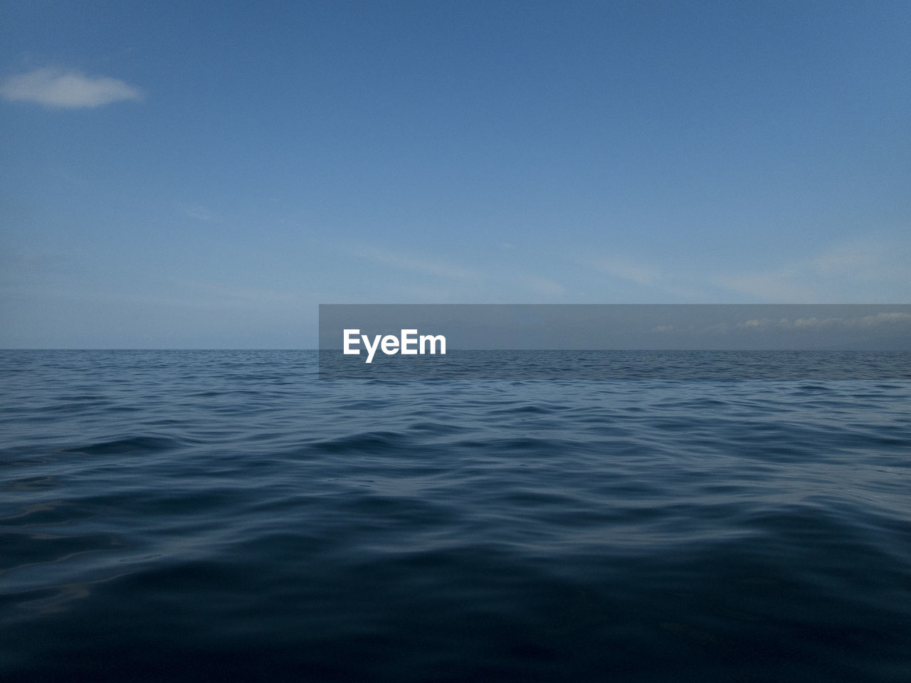 Scenic view of sea against blue sky