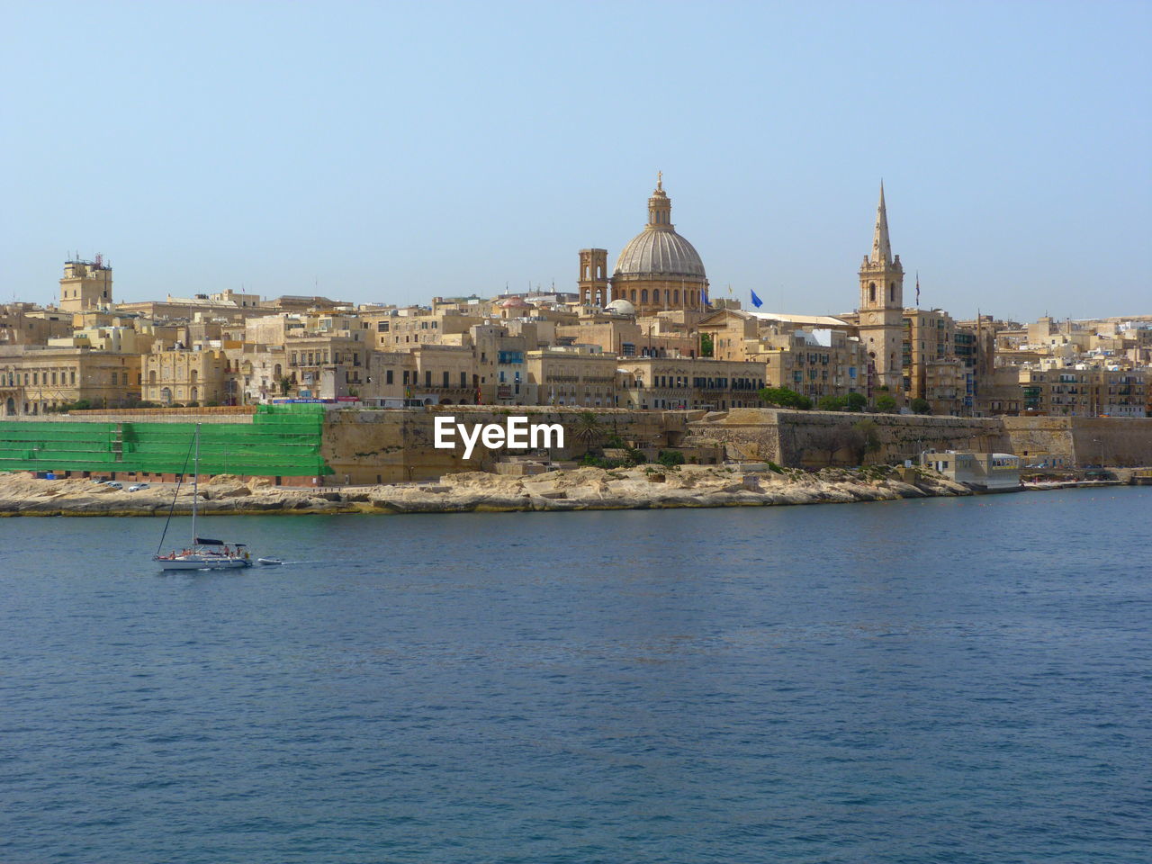 VIEW OF BUILDINGS BY SEA