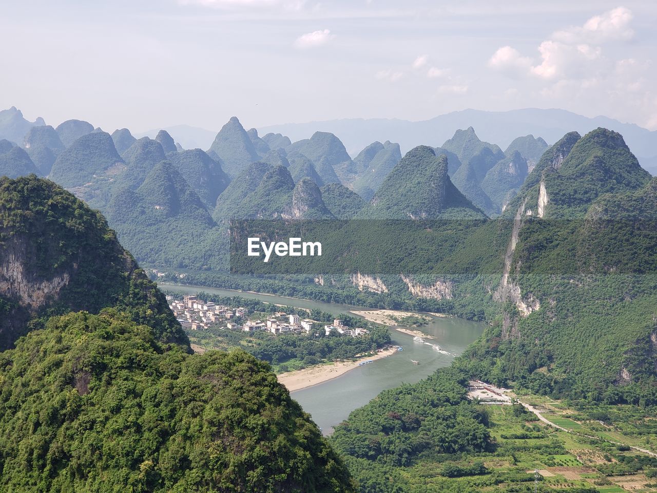 Panoramic view of river and mountains against sky