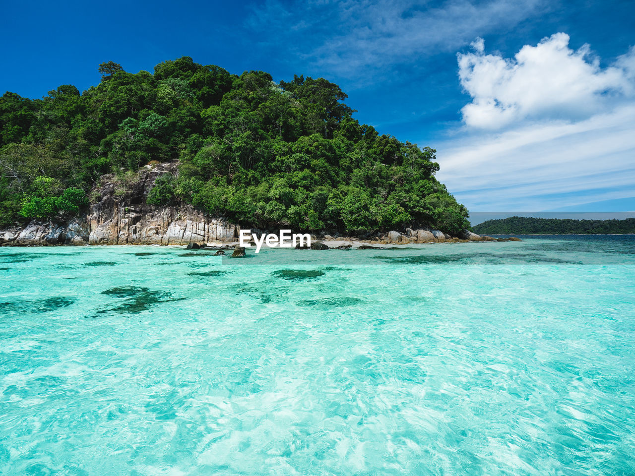 Scenic view of crystal clear turquoise sea against summer blue sky near koh lipe island, thailand.