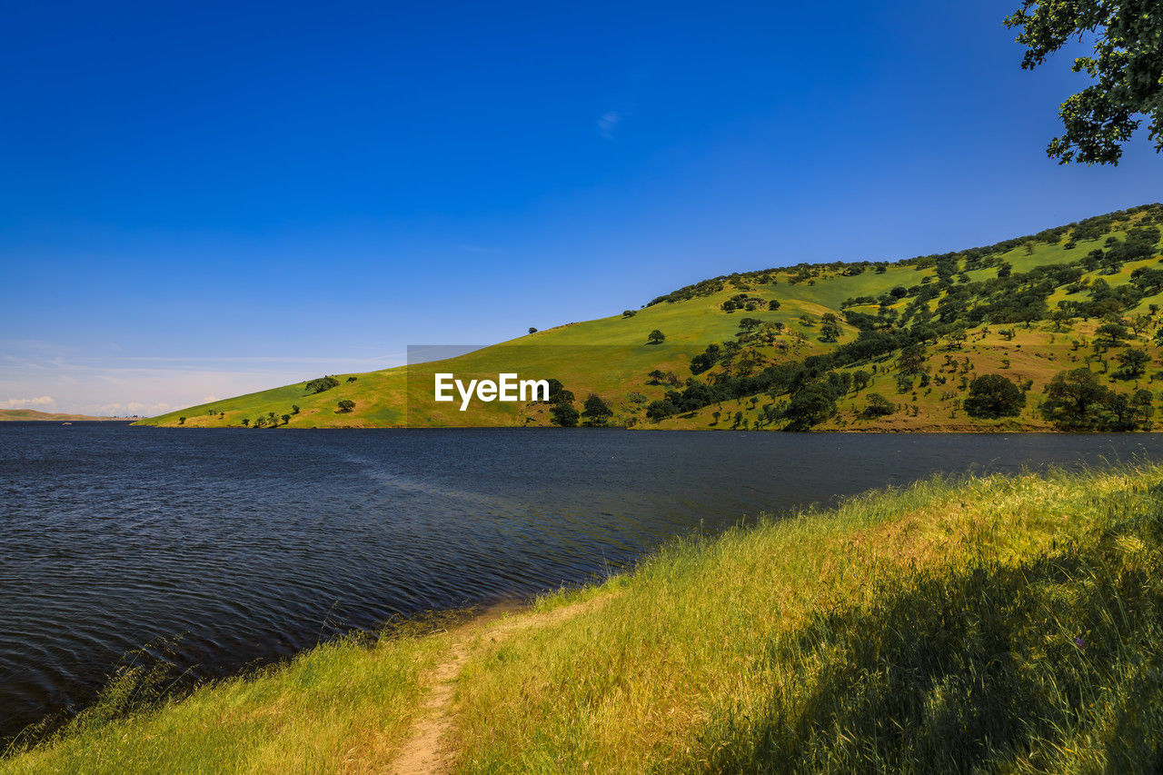 scenic view of mountains against clear blue sky