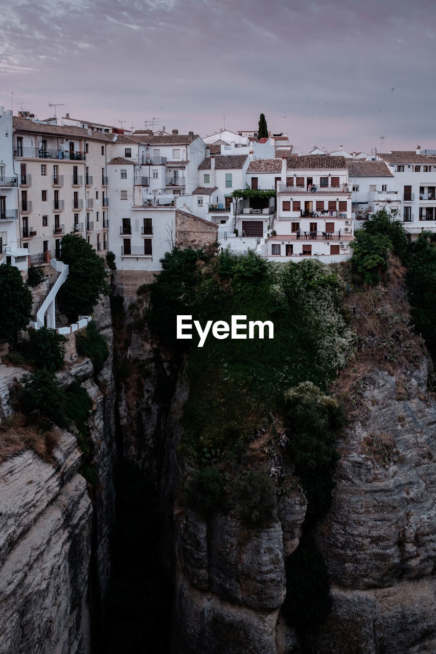 HIGH ANGLE VIEW OF BUILDINGS AND TREES IN CITY