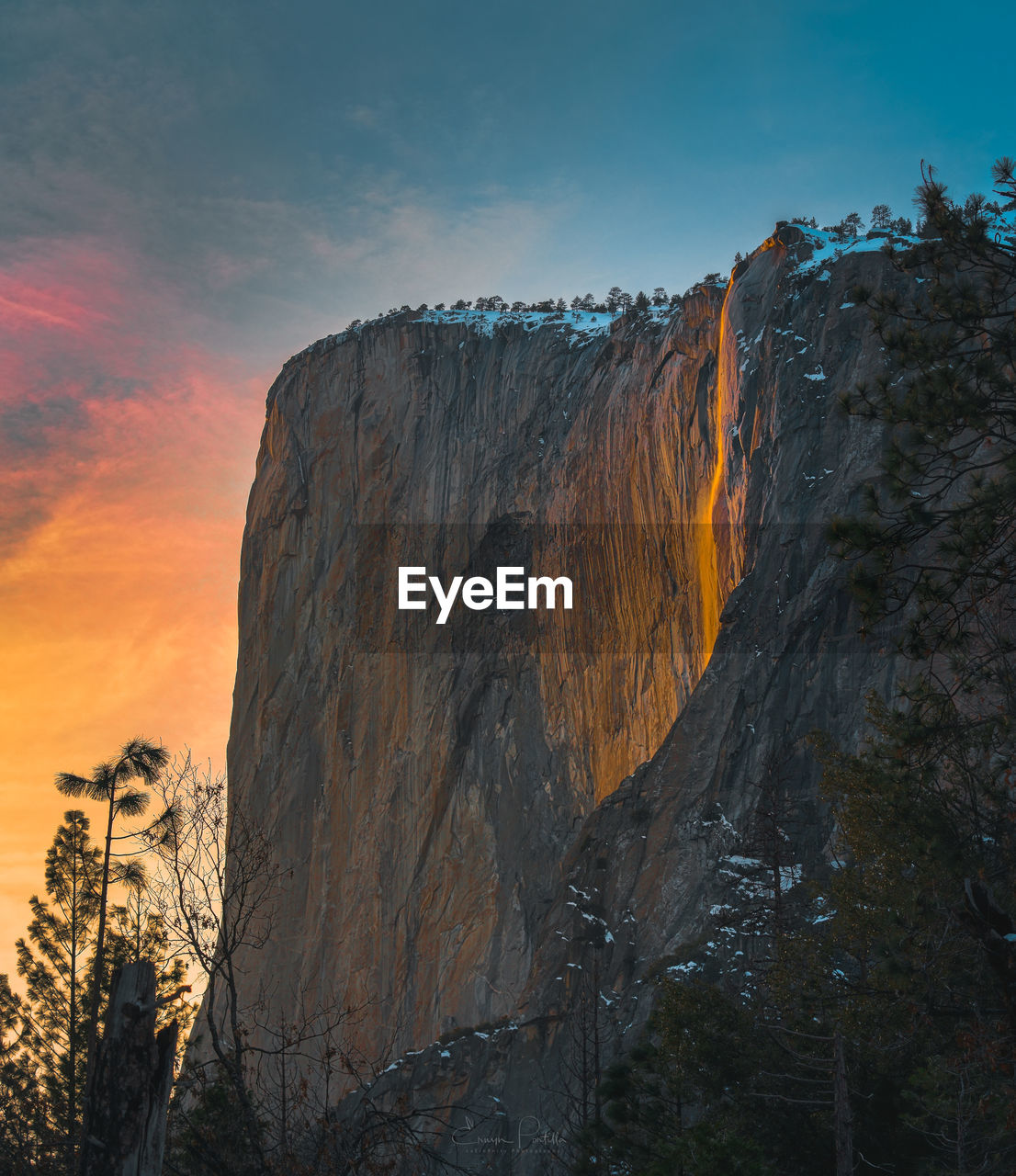 Low angle view of rock formation against sky during sunset