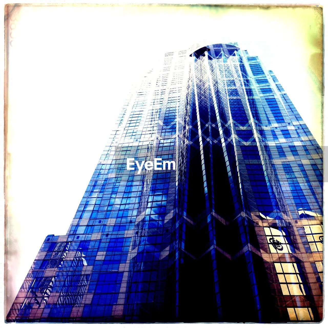 Low angle view of modern office building against sky