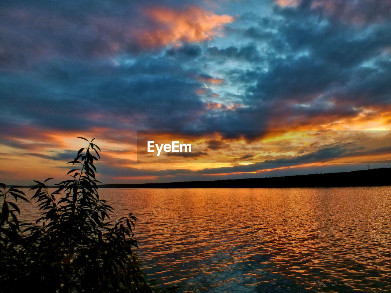 Scenic view of sea against dramatic sky