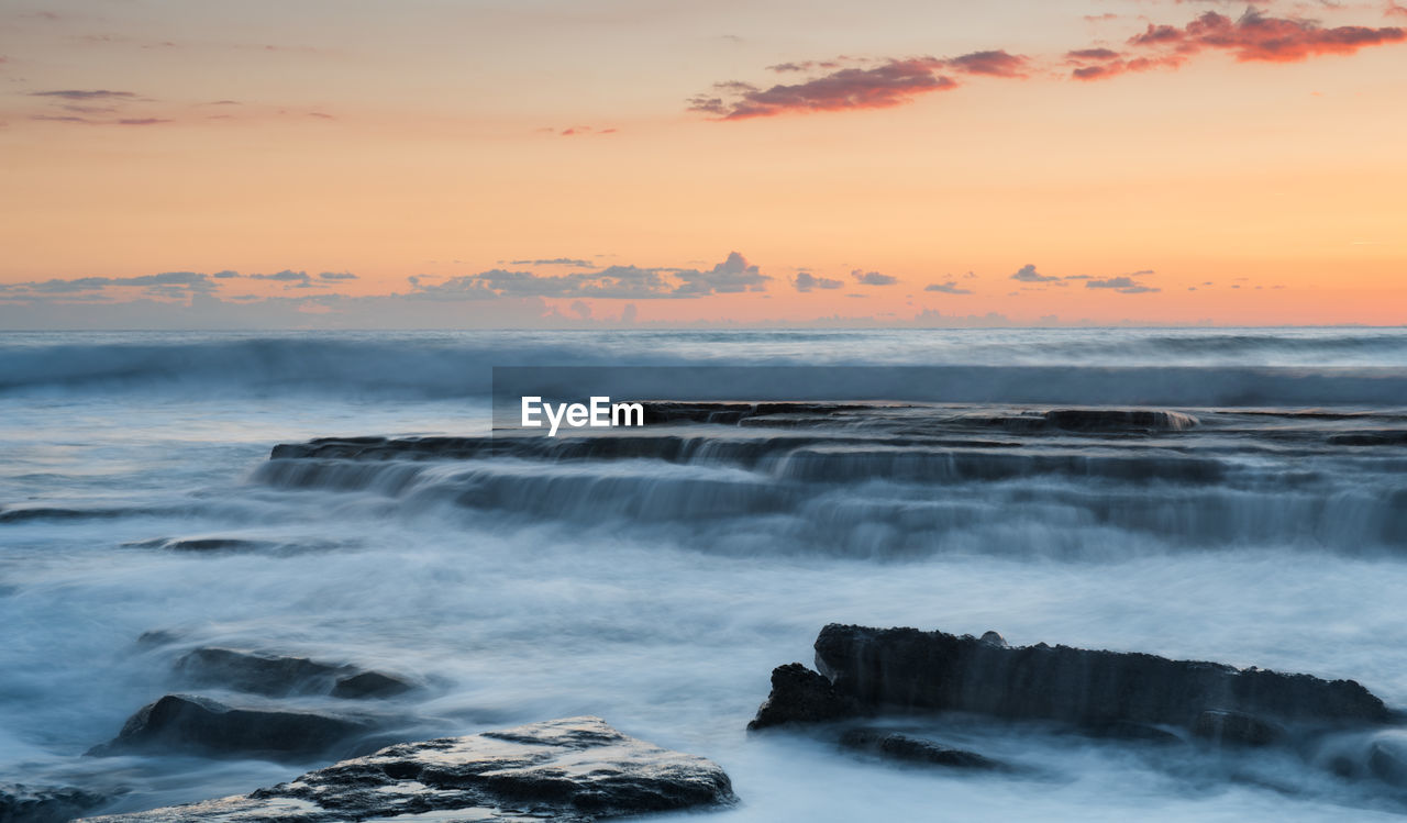 Scenic view of sea against sky during sunset