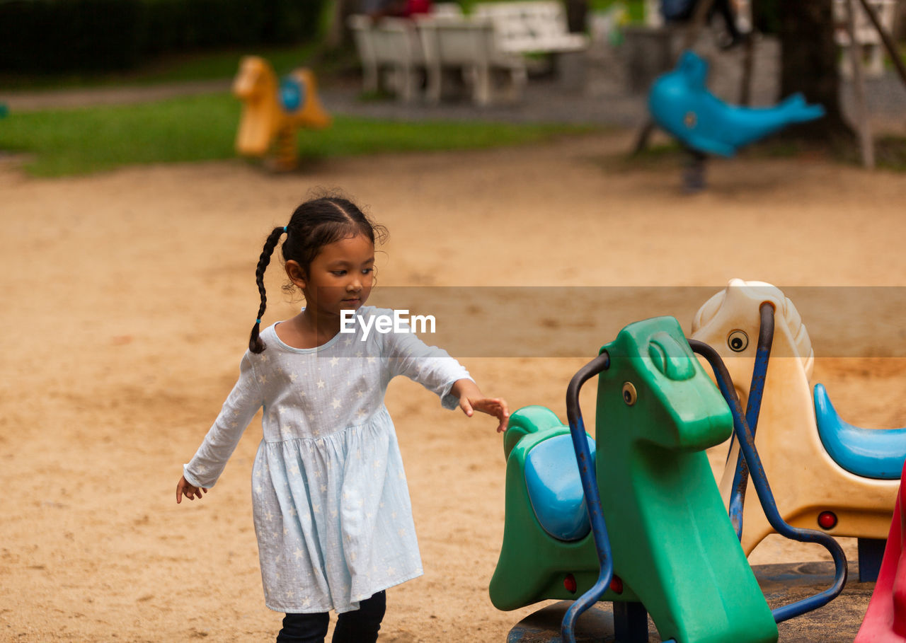 Cute girl playing at playground