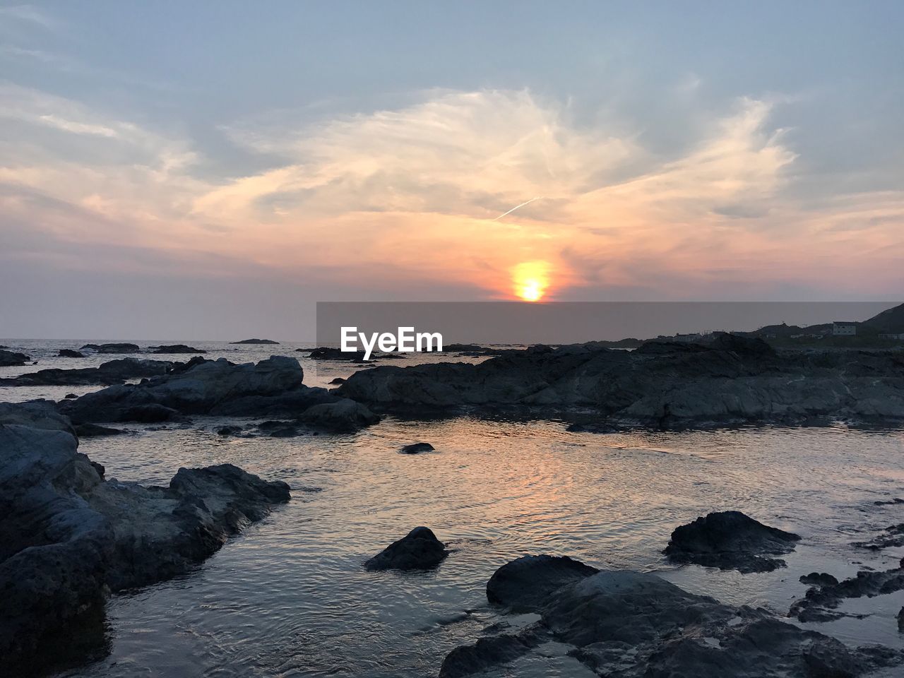 Scenic view of sea against sky during sunset