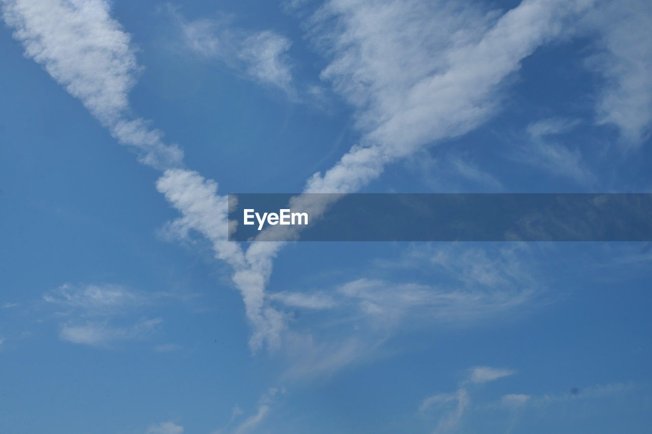 sky, cloud, blue, daytime, no people, nature, white, day, beauty in nature, vapor trail, low angle view, backgrounds, environment, scenics - nature, outdoors, flying, airplane, cloudscape, tranquility