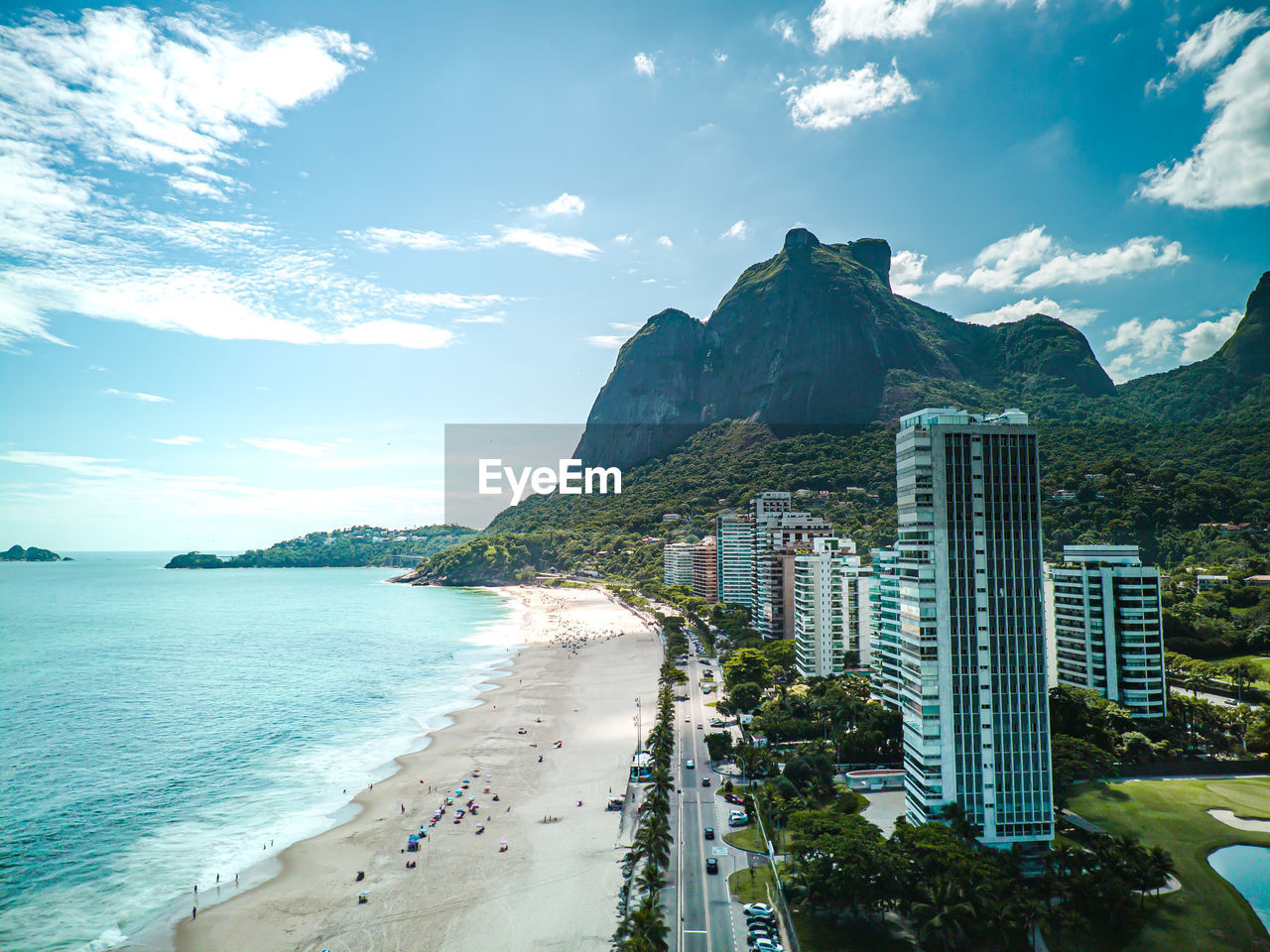 water, sea, sky, beach, land, travel destinations, city, architecture, nature, coast, landscape, travel, scenics - nature, building exterior, building, built structure, coastline, cloud, horizon, vacation, tourism, beauty in nature, ocean, holiday, trip, mountain, environment, urban skyline, bay, bay of water, blue, outdoors, cityscape, skyscraper, body of water, office building exterior, summer, tropical climate, no people, sand, shore, sunlight, tree, day, residential district, tranquility, transportation, tourist resort, island, sports, tranquil scene
