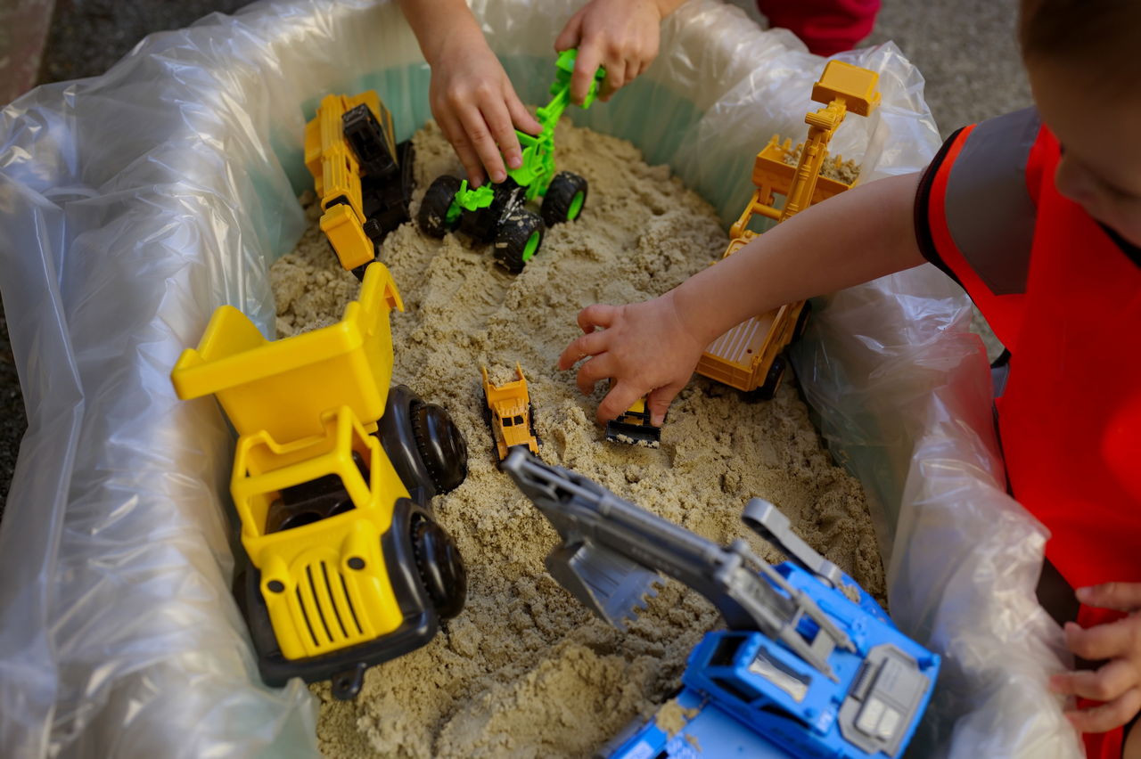 Top shot of toddlers playing in sand