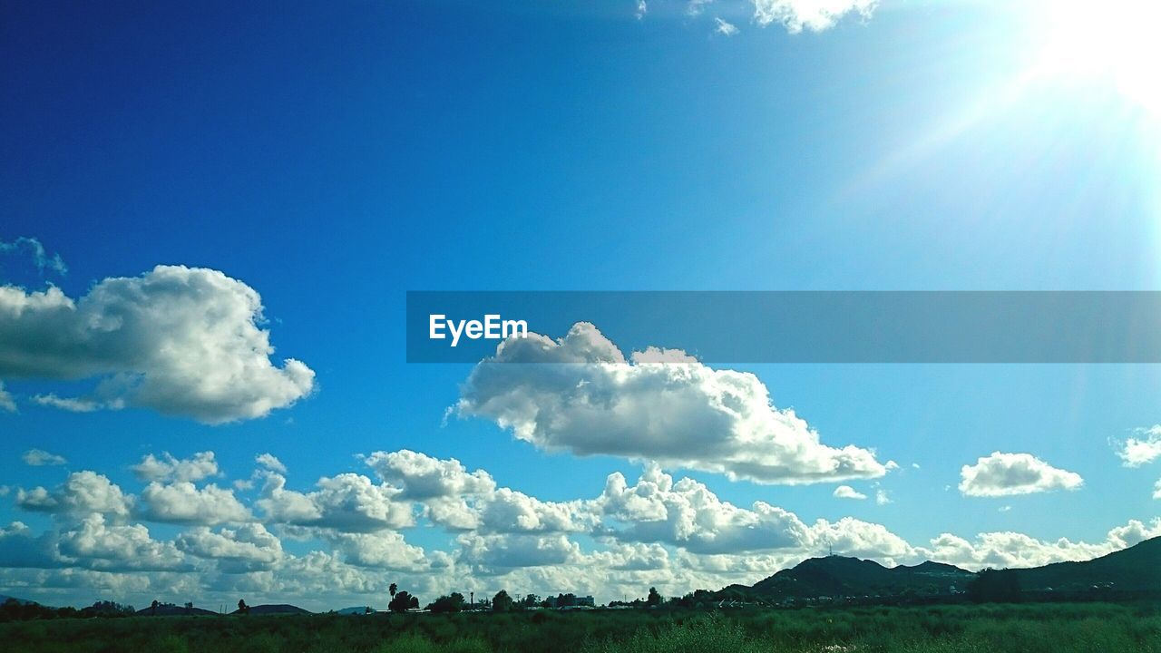 SCENIC VIEW OF LANDSCAPE AGAINST CLOUDY SKY