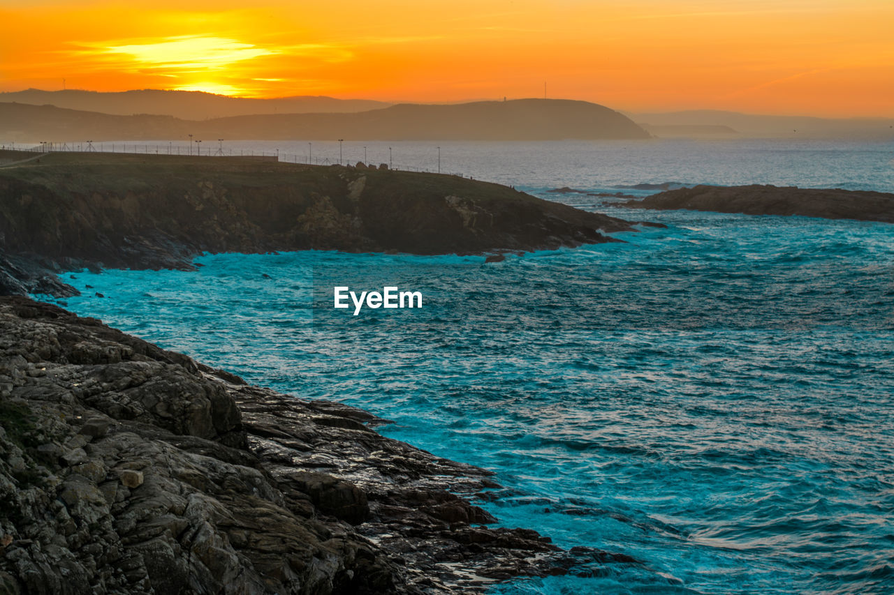 Scenic view of sea against sky during sunset