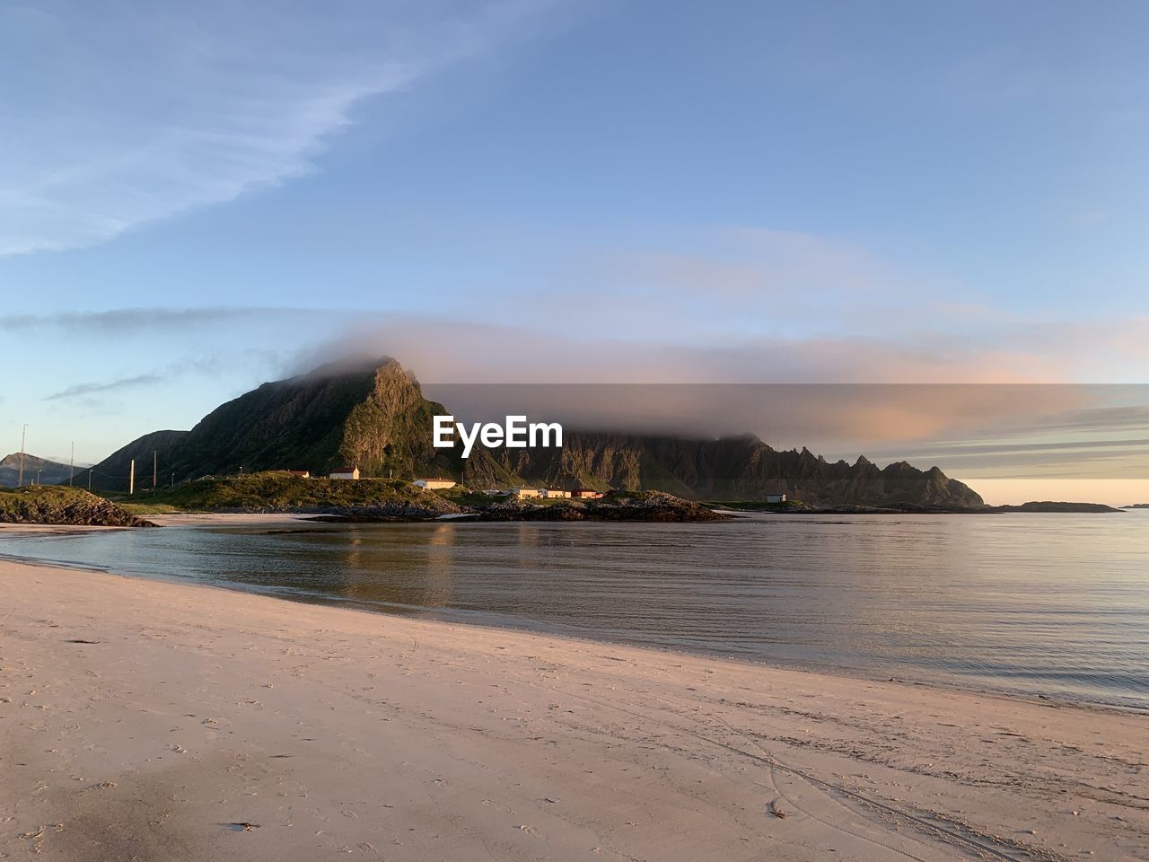 Scenic view of beach against sky during sunset