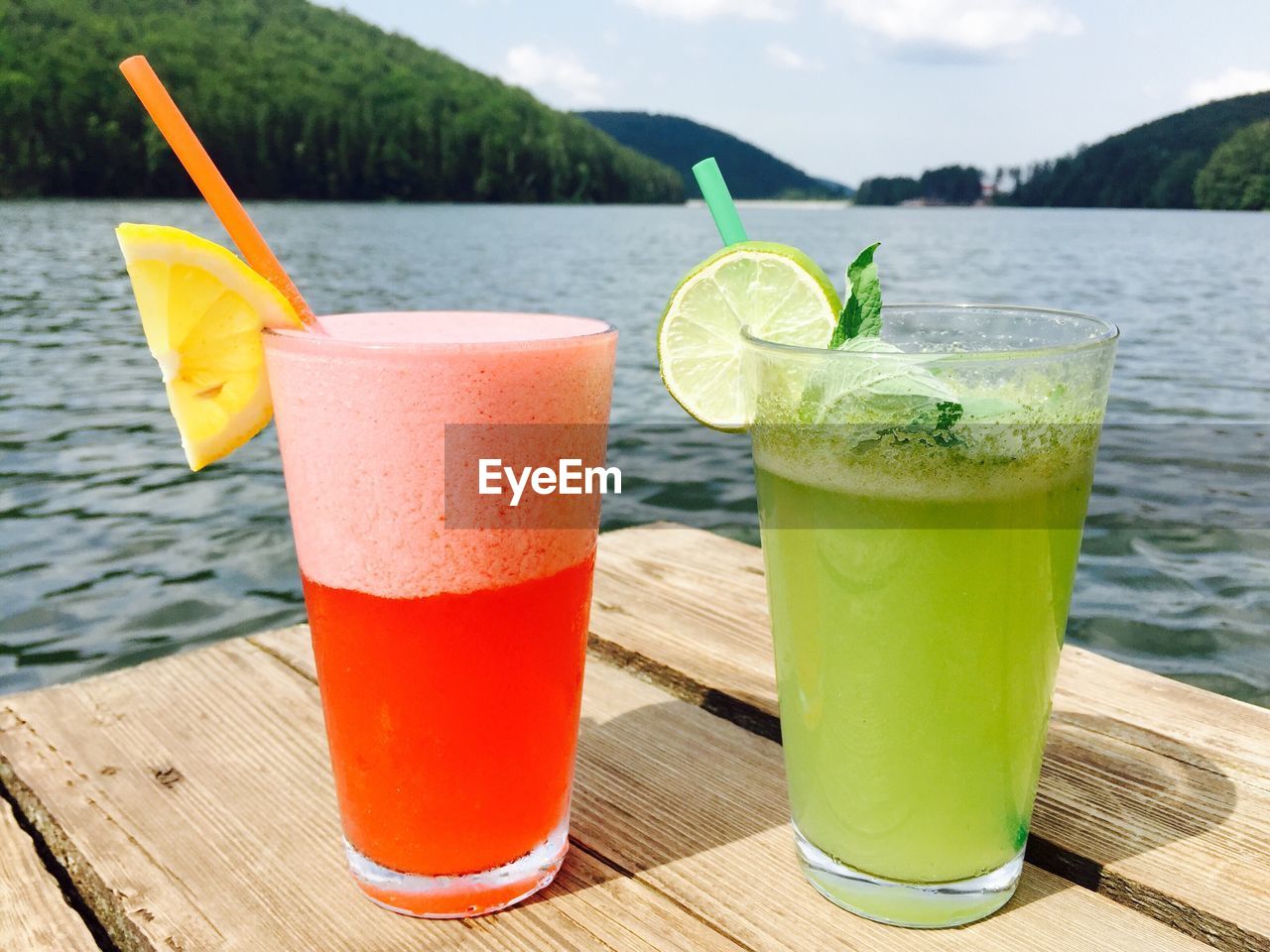 CLOSE-UP OF DRINK WITH JUICE ON TABLE