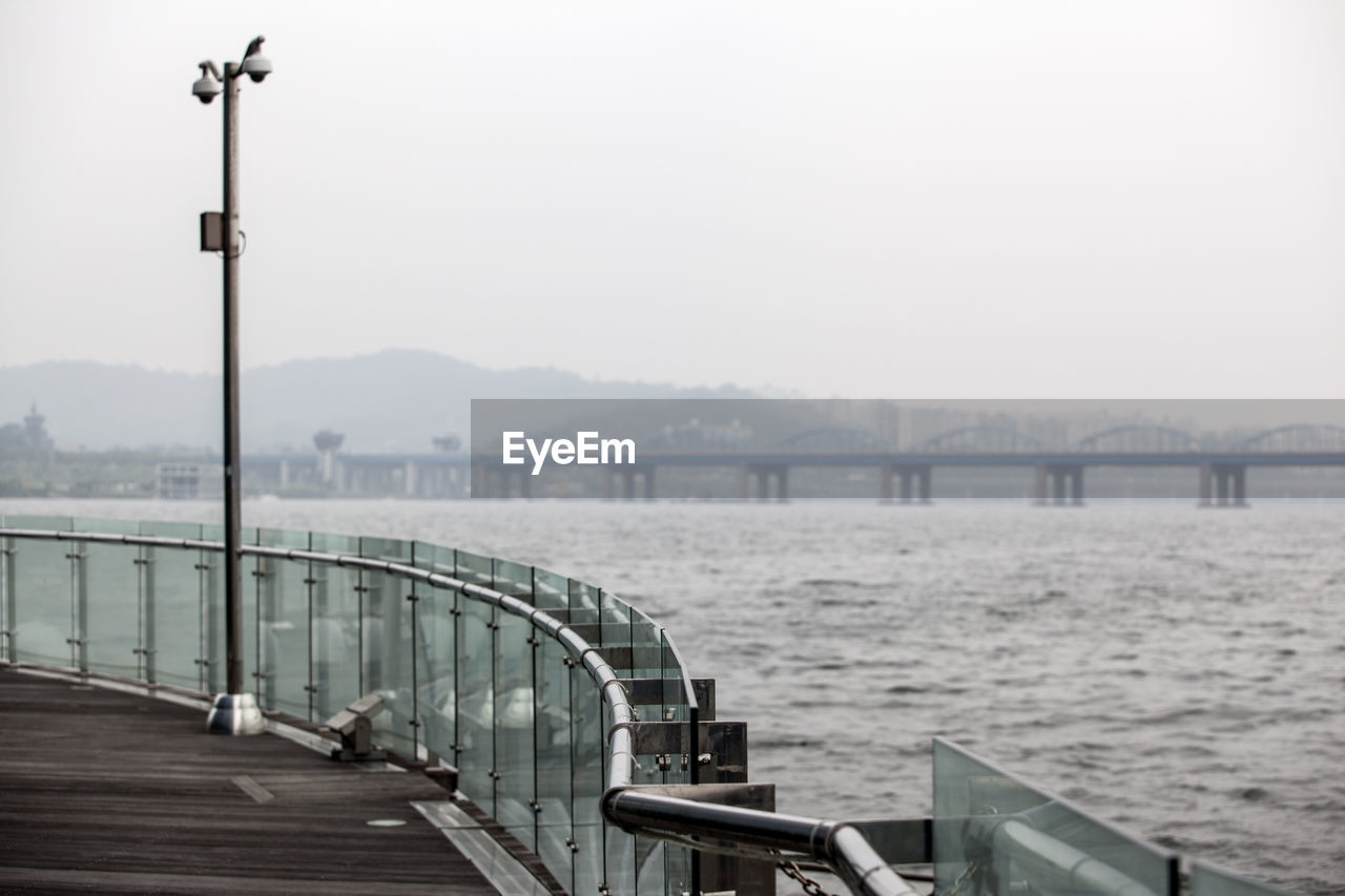 Distant view of dongjak bridge over han river seen from promenade