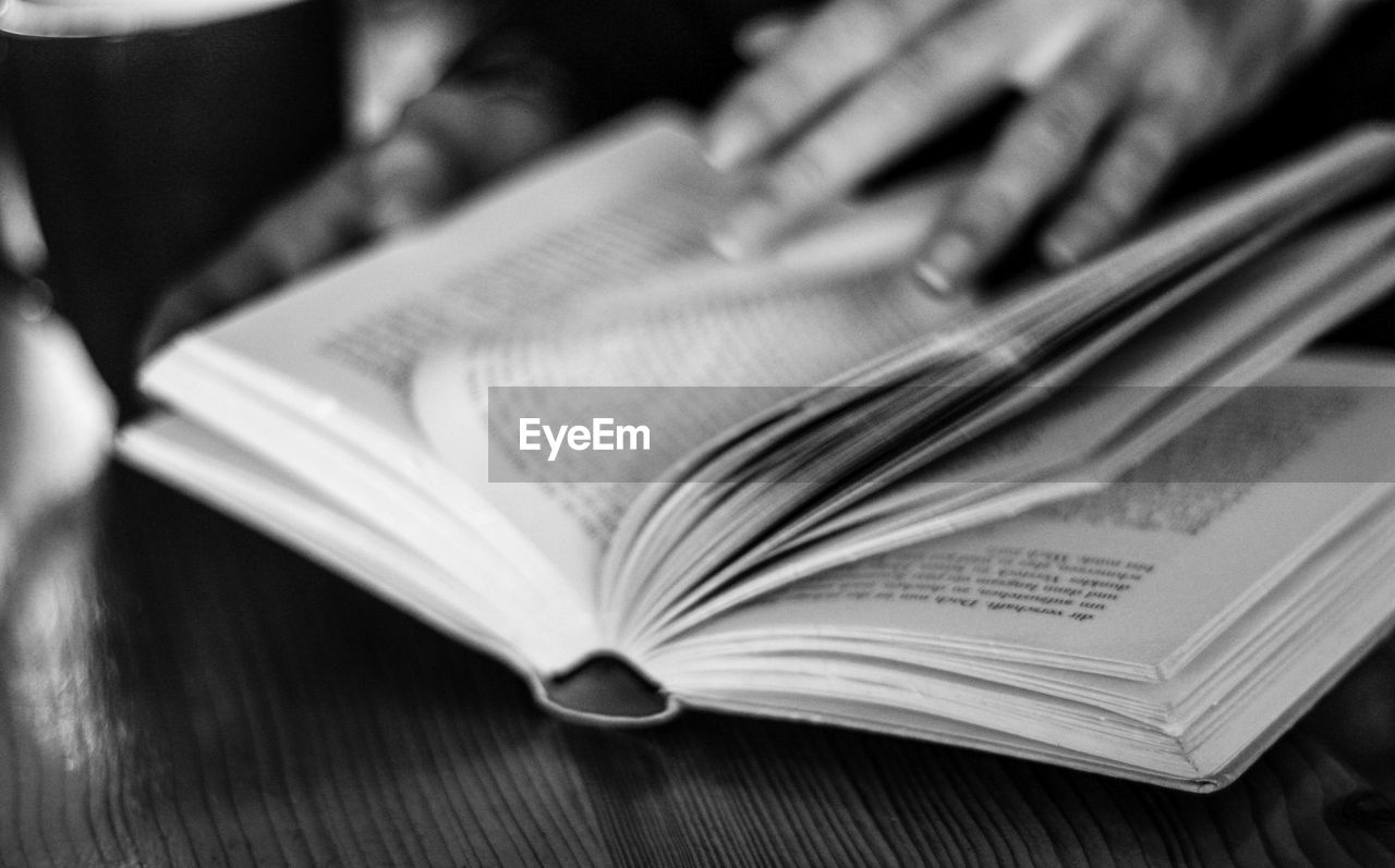 publication, book, black and white, education, close-up, learning, page, reading, writing, paper, monochrome photography, indoors, monochrome, selective focus, activity, studying, table, literature, open, hand, wisdom, document, communication, expertise