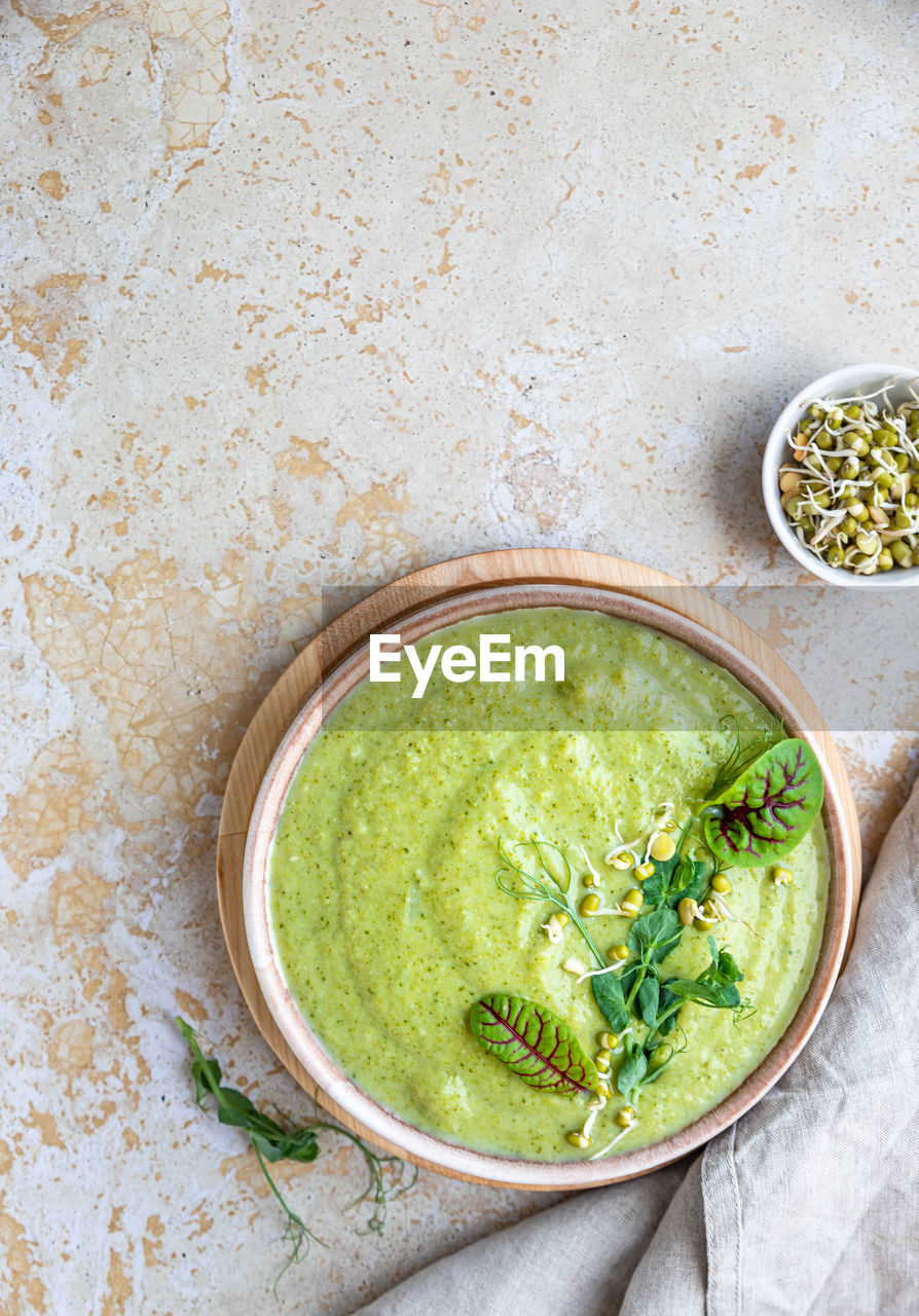 food and drink, food, healthy eating, wellbeing, dish, studio shot, freshness, bowl, high angle view, indoors, plant, produce, green, no people, crockery, green sauce, vegetable, vegetarian food, wood, spice, refreshment, cuisine, herb, drink