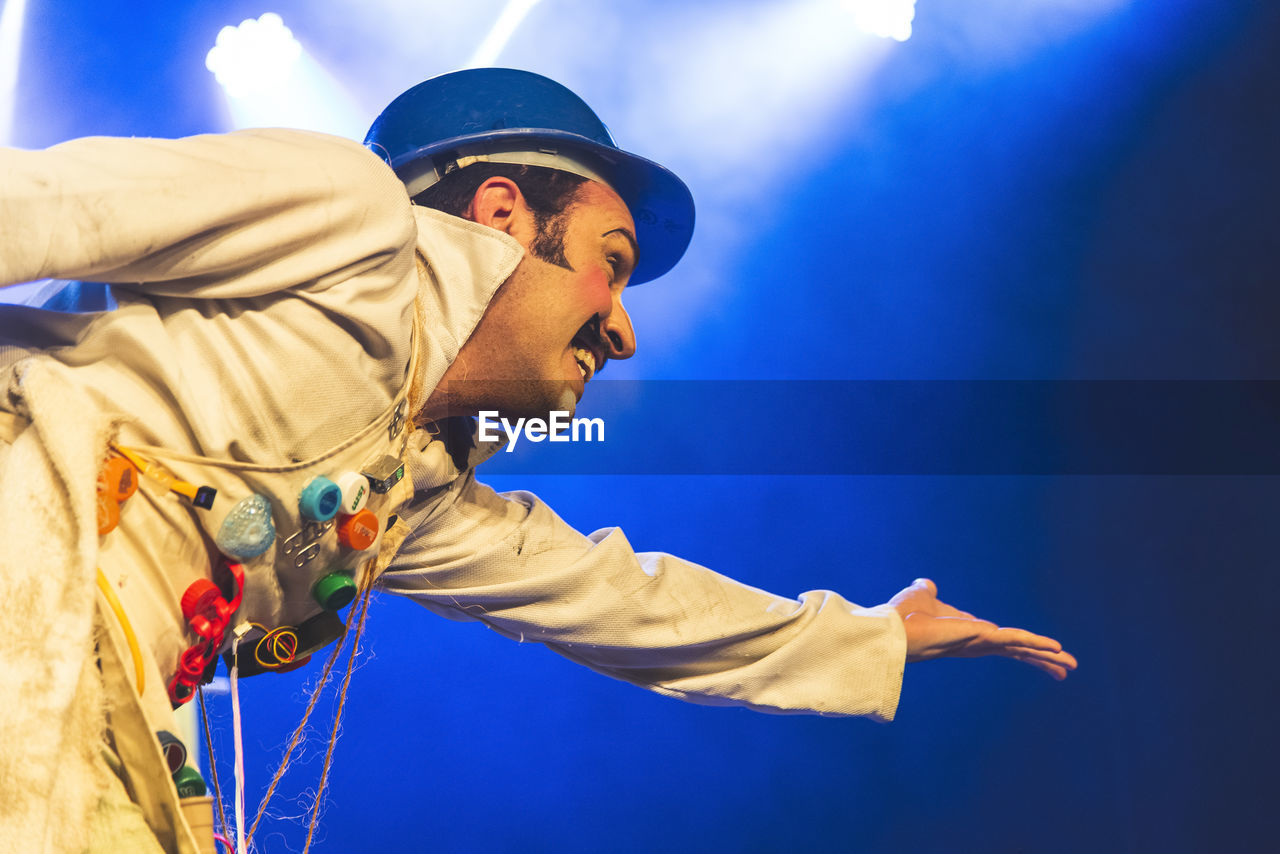 Actor representing a character on the stage of a theater. 