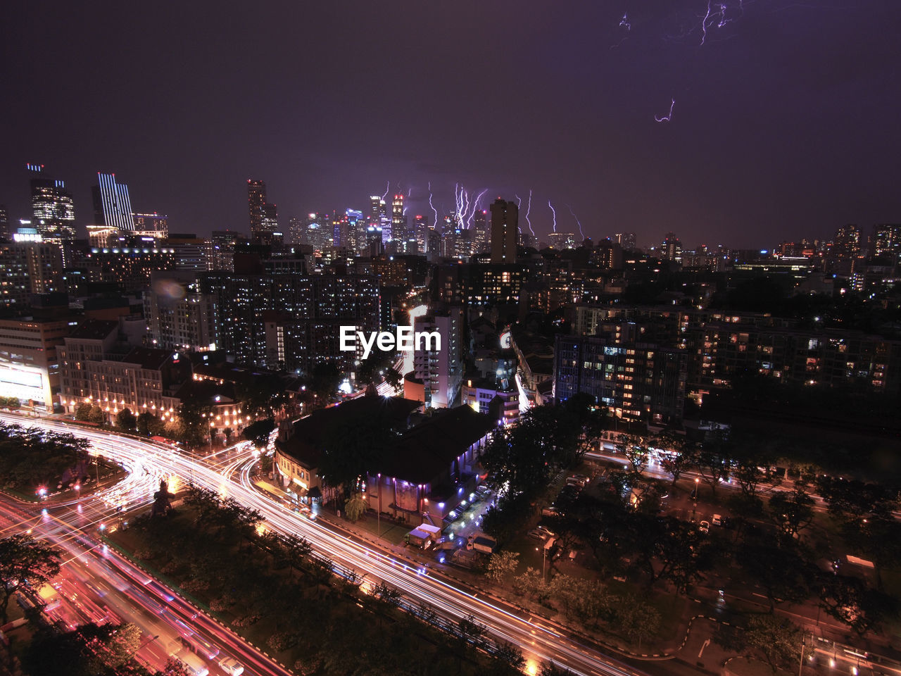 High angle shot of illuminated cityscape against sky at night