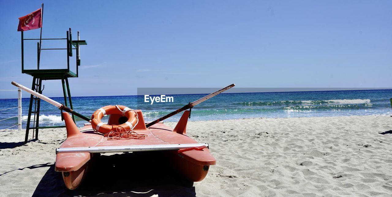 Cropped image of boat on beach