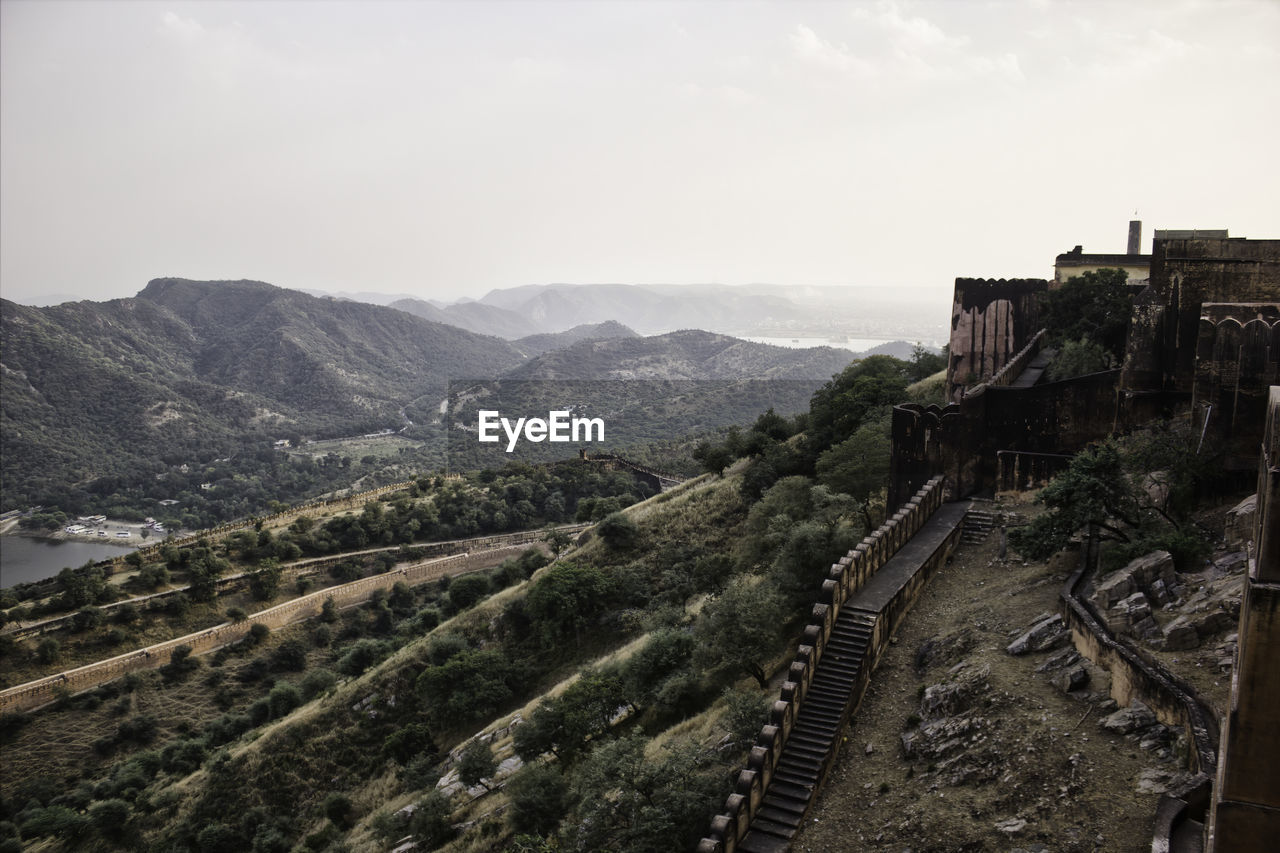 High angle view of castle on mountain against sky in jaipur