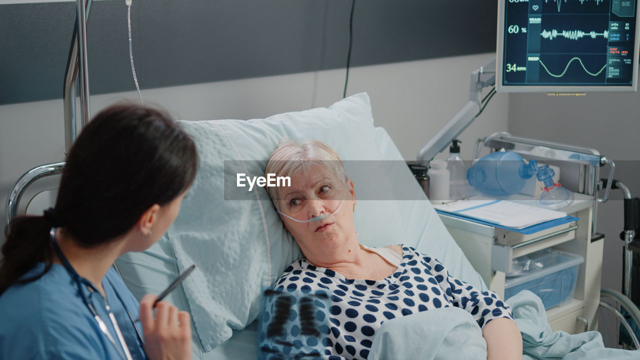 Doctor examining patient in hospital