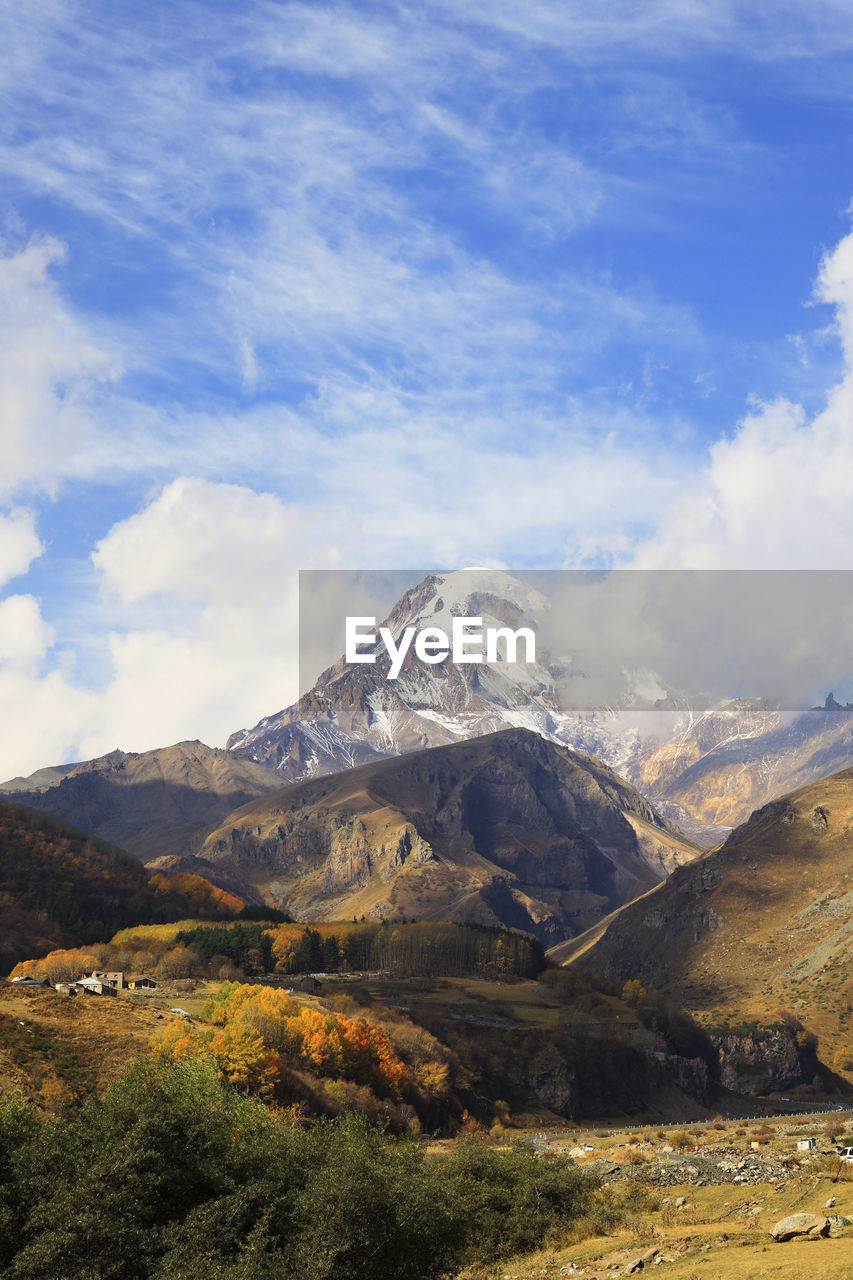 Scenic view of snowcapped mountains against sky