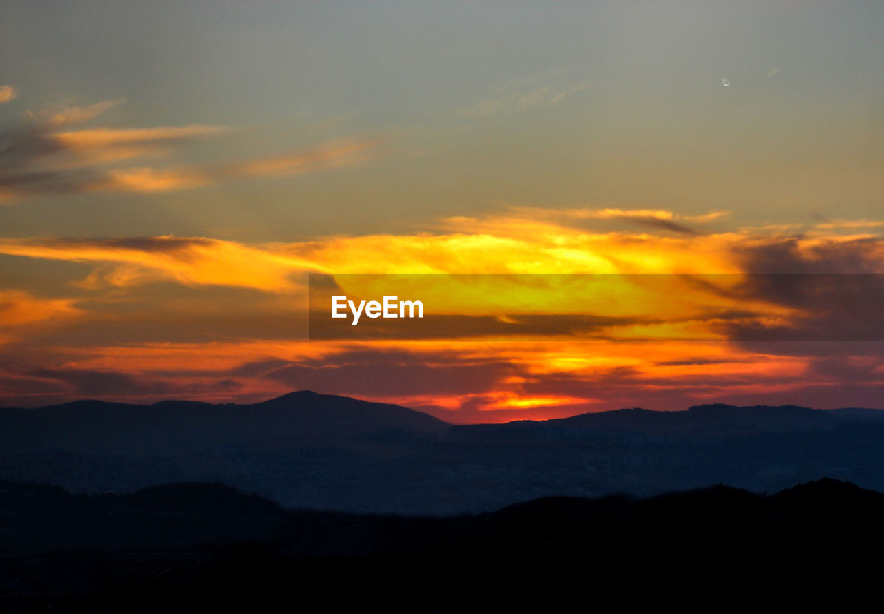 SUNSET OVER MOUNTAINS