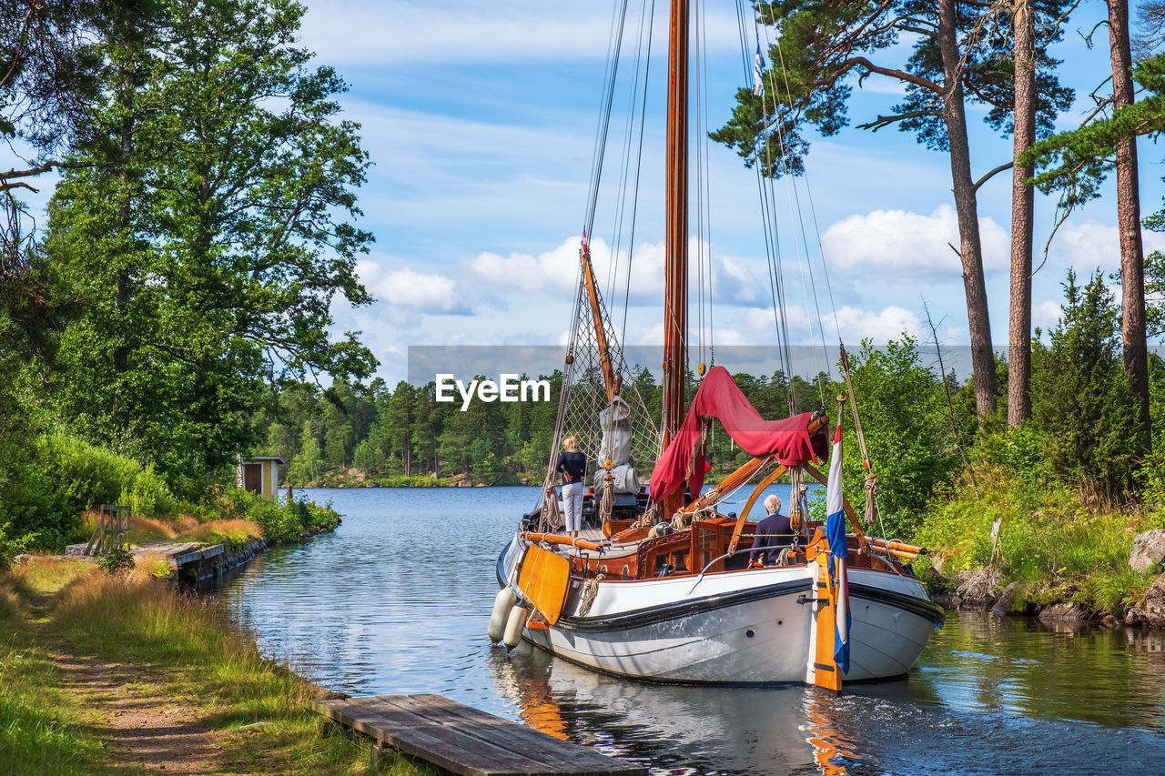 Beautiful wooden sailboat on göta canal in sweden a summer day