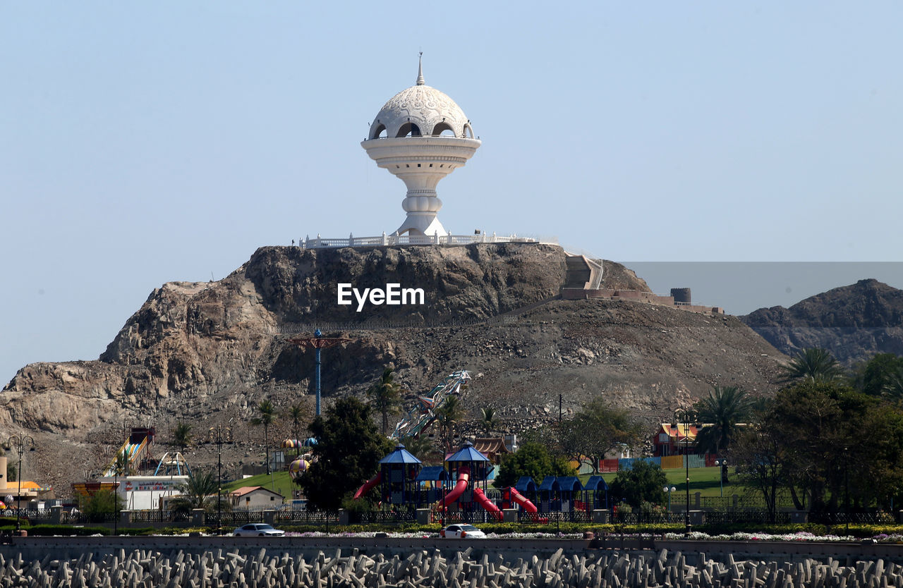 VIEW OF CASTLE ON MOUNTAIN AGAINST SKY