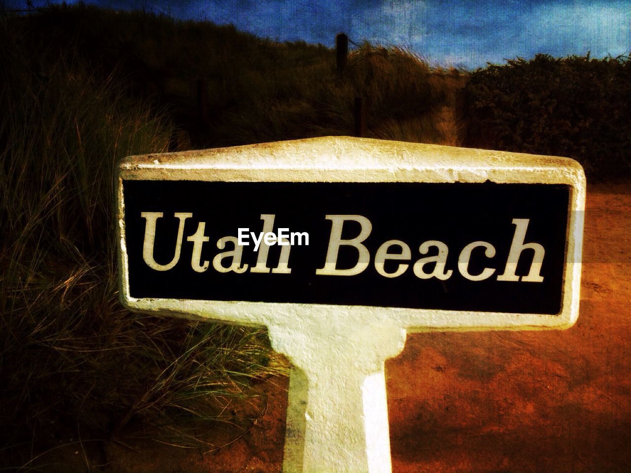 Close-up of beach sign