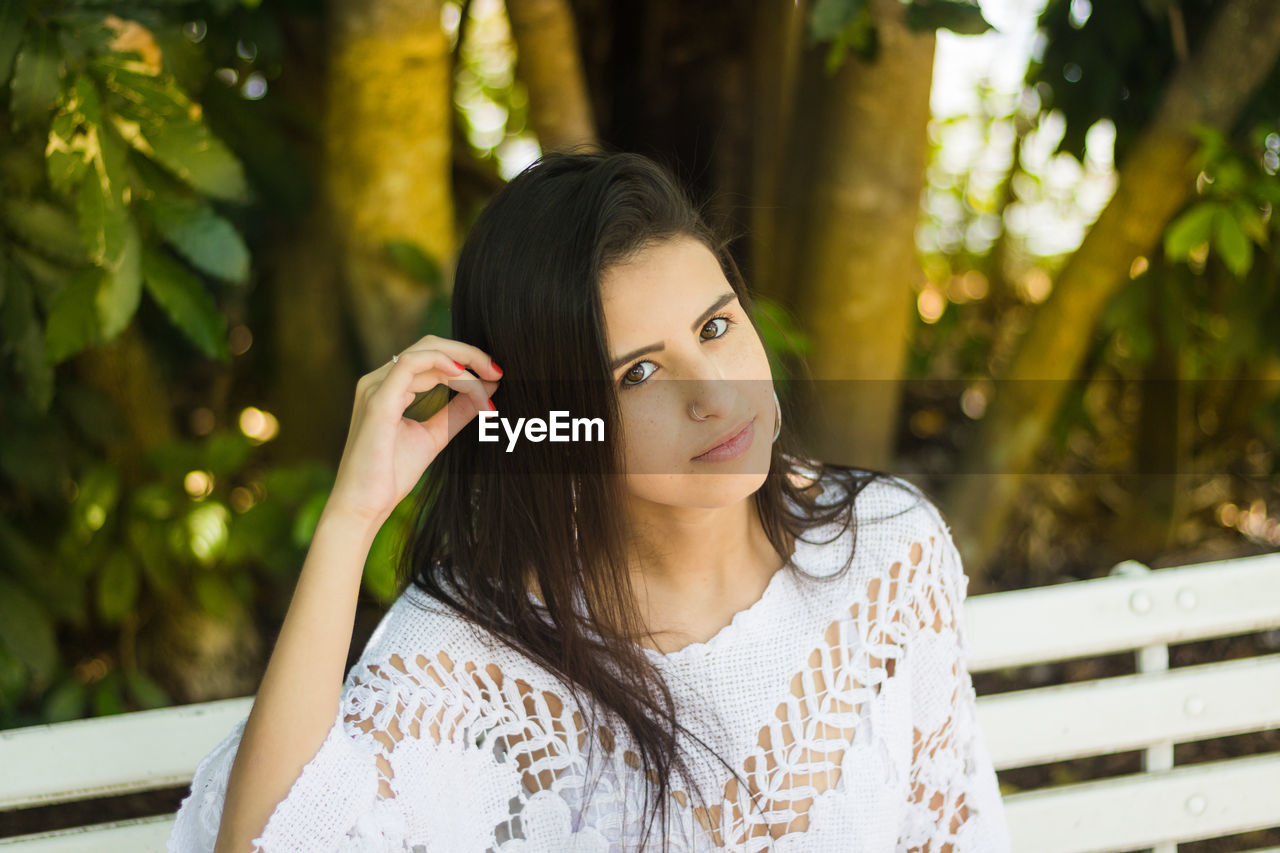 Young woman sitting outdoors