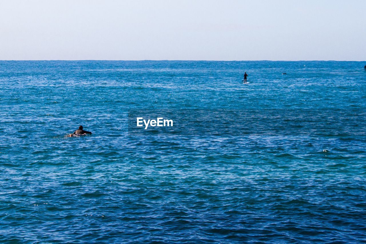 Scenic view of blue sea against clear sky