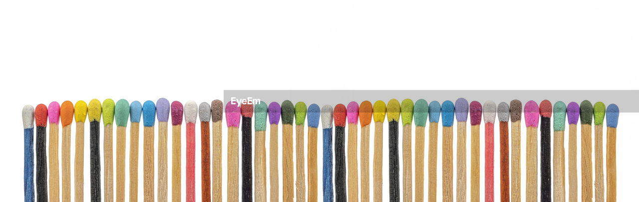 Matchsticks various colors on white background