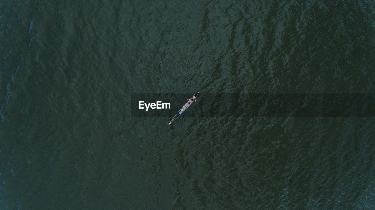 High angle view of person on rowboat in sea