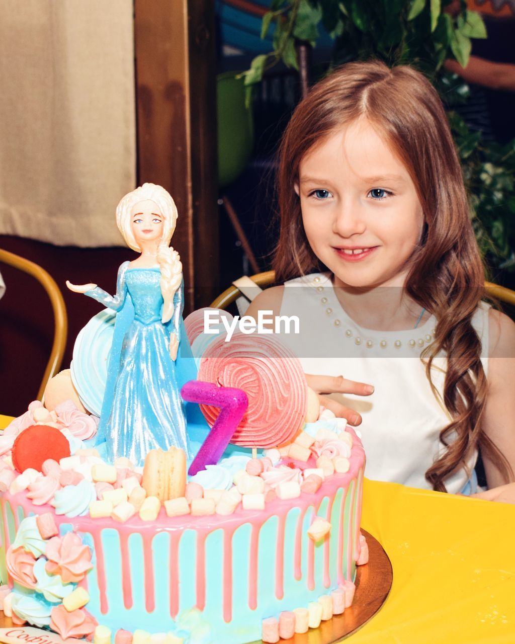 Girl looking at birthday cake