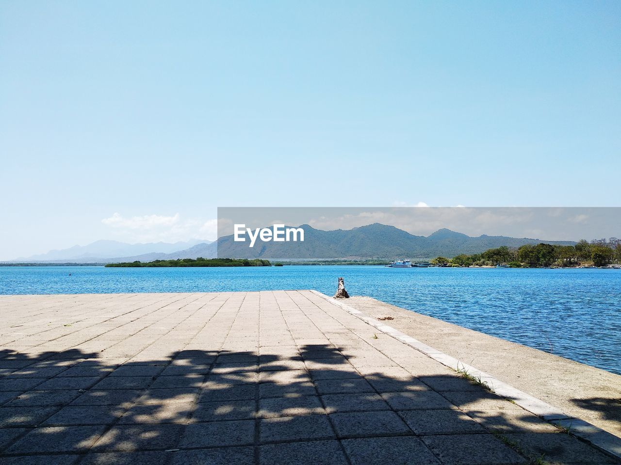 Scenic view of sea against blue sky