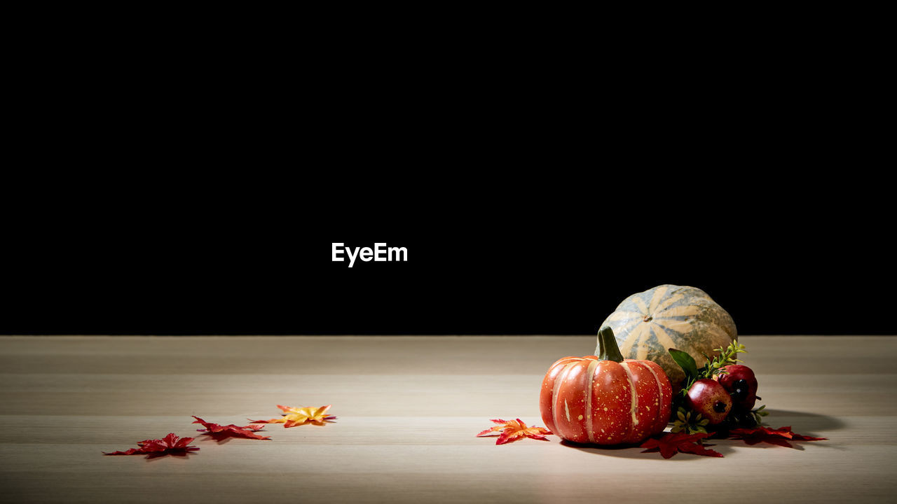 CLOSE-UP OF FRUITS OVER BLACK BACKGROUND