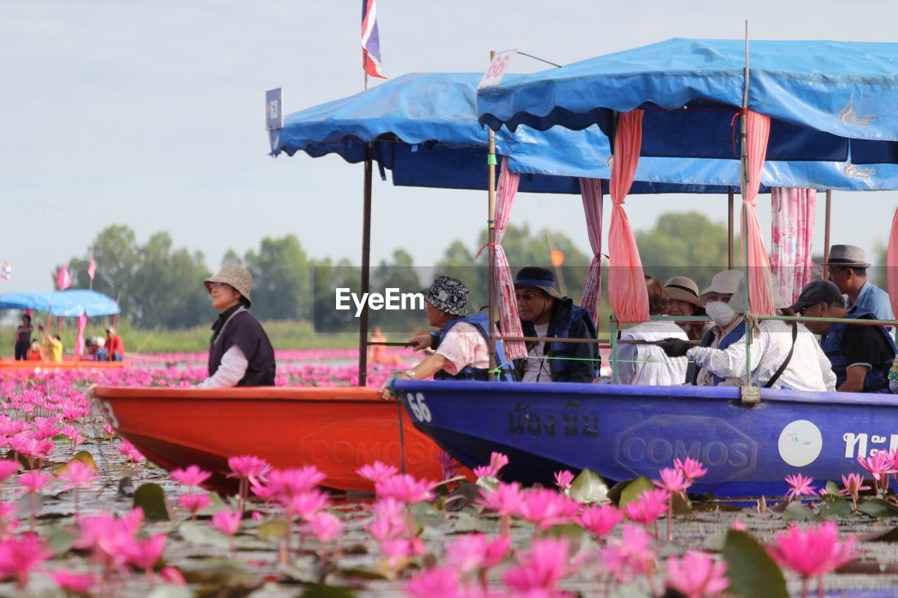 GROUP OF PEOPLE ON BOAT