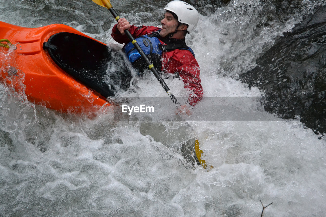 High angle view of man kayaking in river