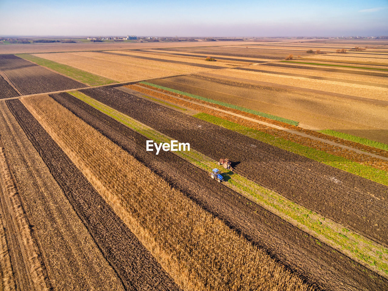 Scenic view of agricultural landscape against sky