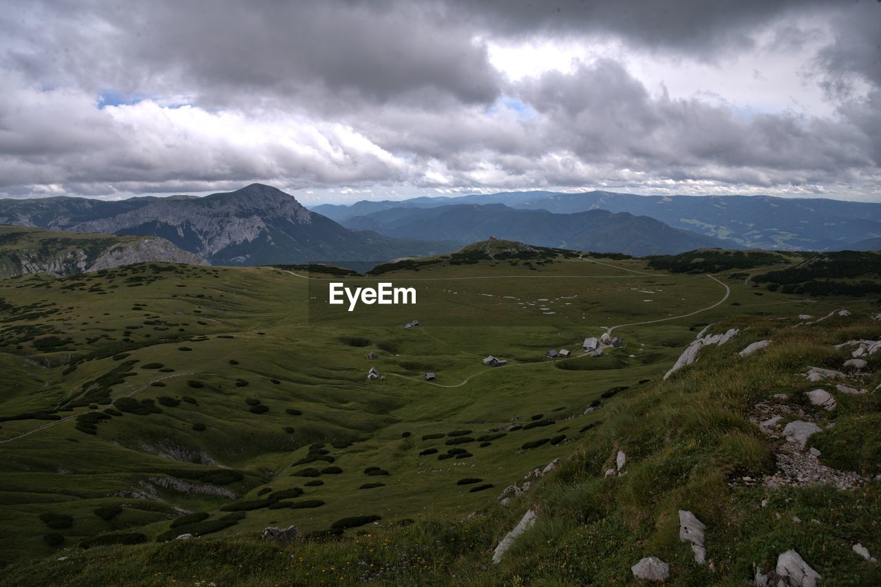 scenic view of landscape and mountains against sky