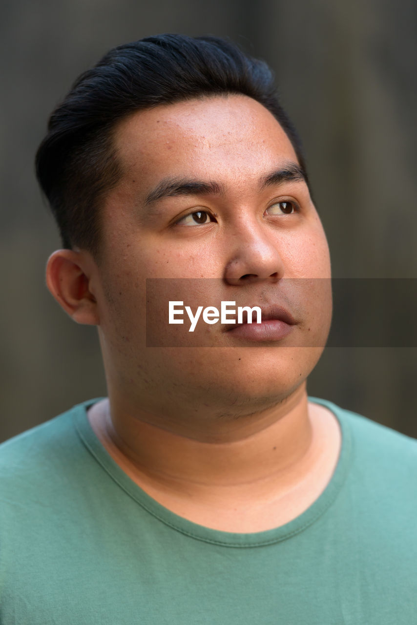 Close-up portrait of serious young man