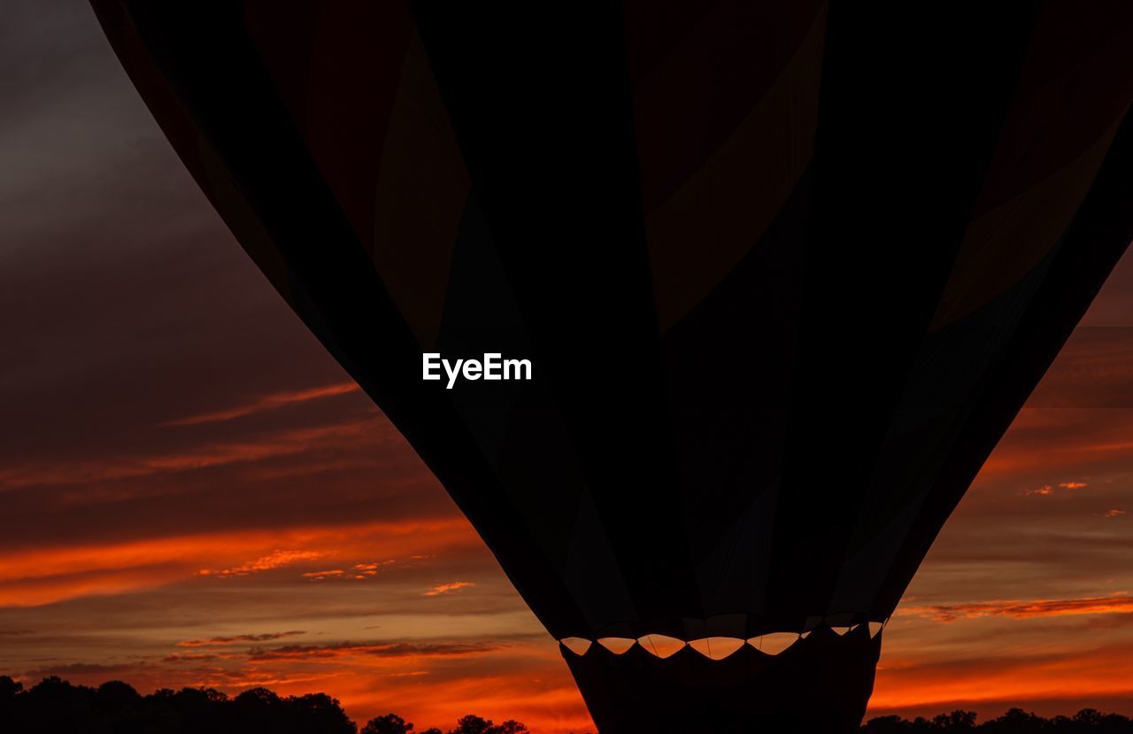 LOW ANGLE VIEW OF ILLUMINATED ORANGE SKY