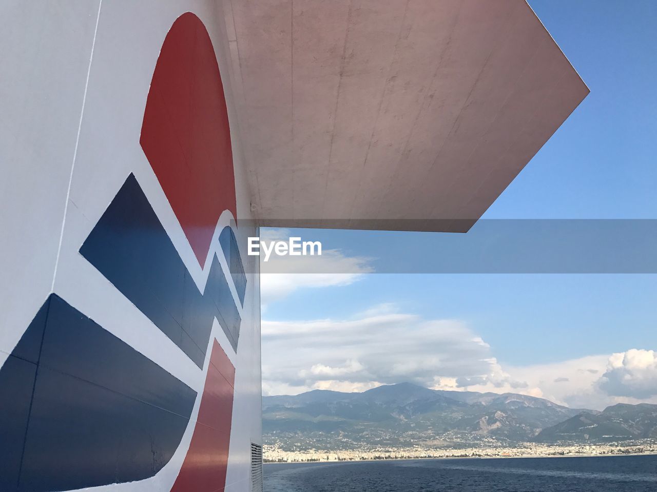 CLOSE-UP OF AIRPLANE ON MOUNTAIN AGAINST BLUE SKY