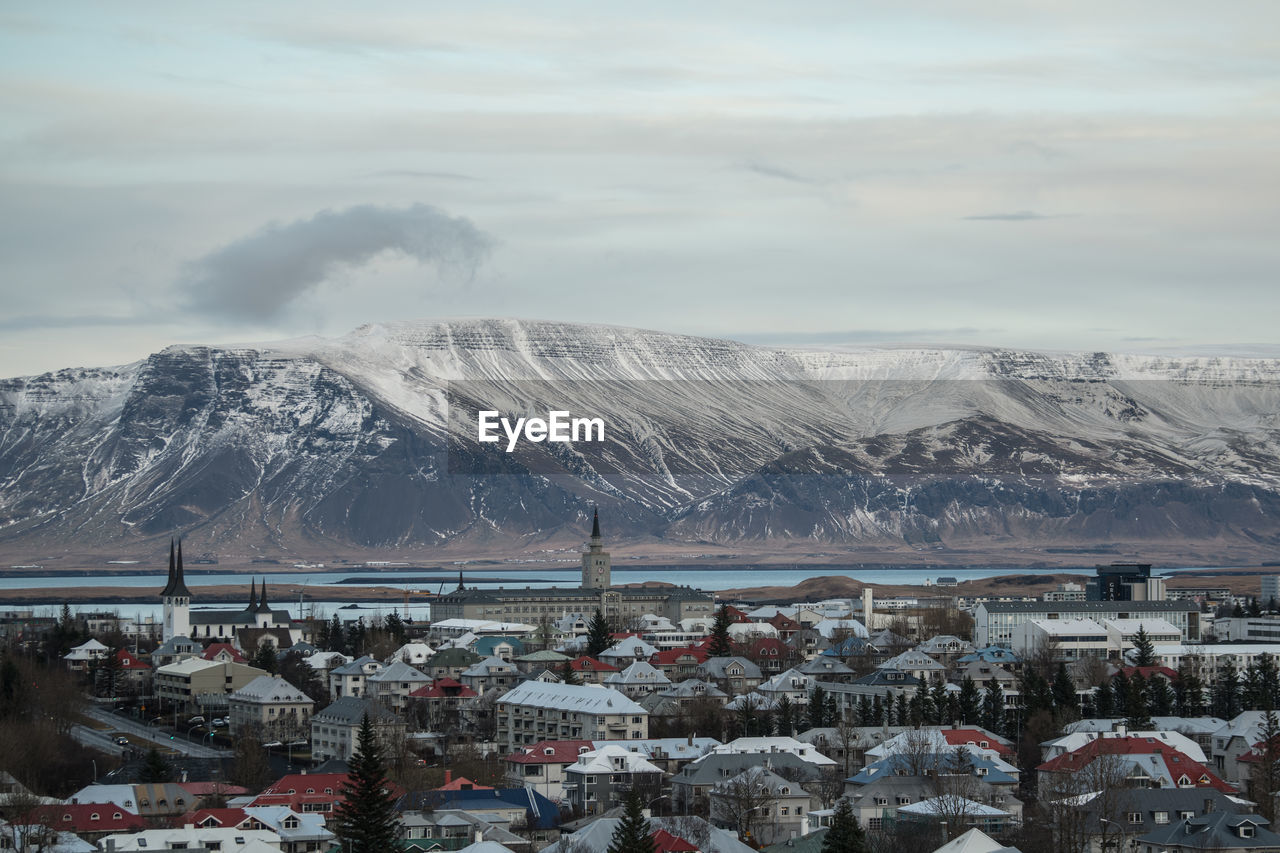 Aerial view of snowcapped mountains against sky